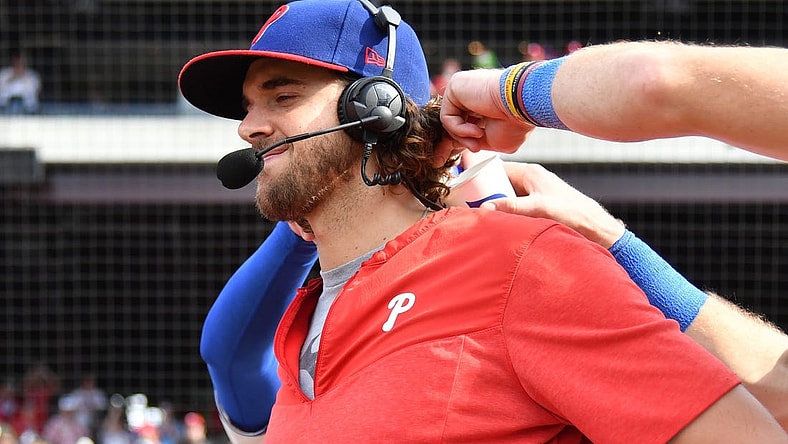 Aug 27, 2023; Philadelphia, Pennsylvania, USA; Philadelphia Phillies starting pitcher Aaron Nola (27) has water poured down his back by teammates after win against the St. Louis Cardinals at Citizens Bank Park. Mandatory Credit: Eric Hartline-USA TODAY Sports