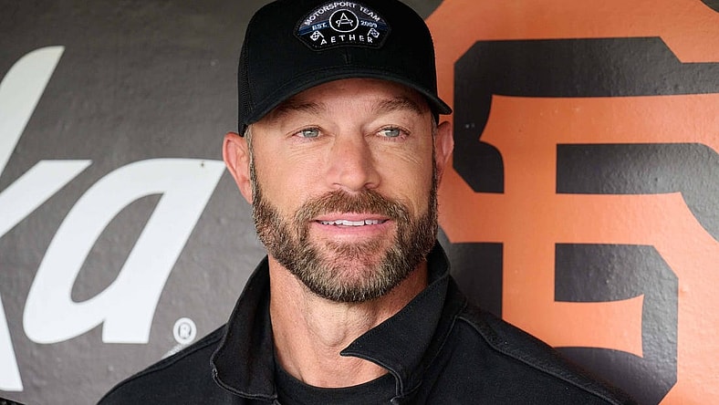 Aug 26, 2023; San Francisco, California, USA; San Francisco Giants manager Gabe Kapler (19) smiles in the dugout before the game against the Atlanta Braves at Oracle Park. Mandatory Credit: Robert Edwards-USA TODAY Sports