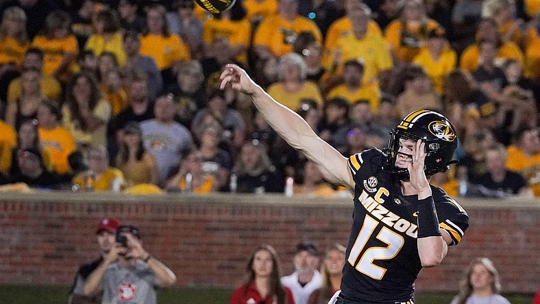 Aug 31, 2023; Columbia, Missouri, USA; Missouri Tigers quarterback Brady Cook (12) throws a pass against the South Dakota Coyotes during the first half at Faurot Field at Memorial Stadium. Mandatory Credit: Denny Medley-USA TODAY Sports