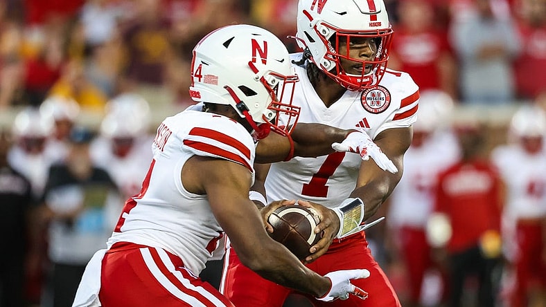 Aug 31, 2023; Minneapolis, Minnesota, USA; Nebraska Cornhuskers quarterback Jeff Sims (7) hands the ball off to running back Rahmir Johnson (14) during the second quarter against the Minnesota Golden Gophers at Huntington Bank Stadium. Mandatory Credit: Matt Krohn-USA TODAY Sports