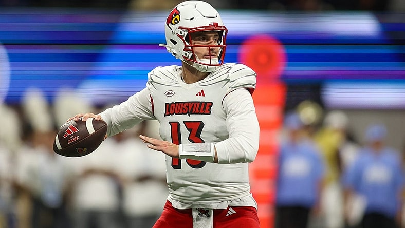 Sep 1, 2023; Atlanta, Georgia, USA; Louisville Cardinals quarterback Jack Plummer (13) looks to throw against the Georgia Tech Yellow Jackets in the second quarter at Mercedes-Benz Stadium. Mandatory Credit: Brett Davis-USA TODAY Sports