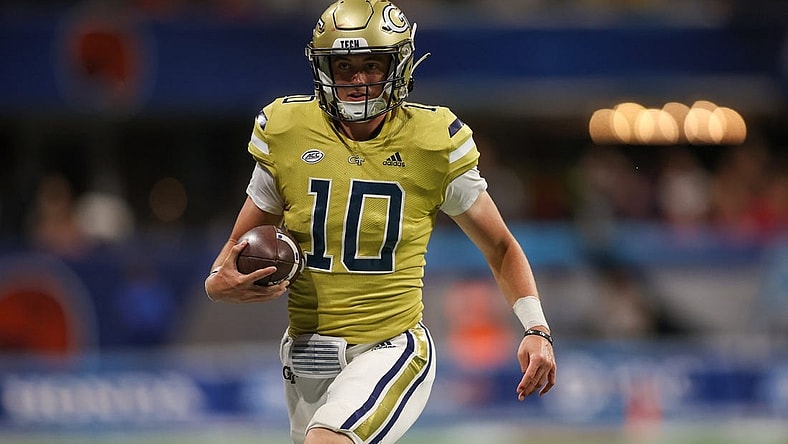 Sep 1, 2023; Atlanta, Georgia, USA; Georgia Tech Yellow Jackets quarterback Haynes King (10) runs the ball against the Louisville Cardinals in the fourth quarter at Mercedes-Benz Stadium. Mandatory Credit: Brett Davis-USA TODAY Sports