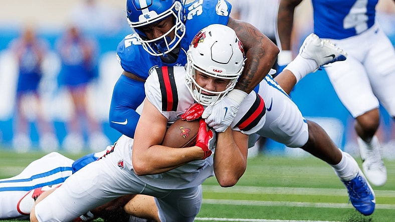 Sep 2, 2023; Lexington, Kentucky, USA; Ball State Cardinals tight end Tanner Koziol (88) is tackled by Kentucky Wildcats linebacker Trevin Wallace (32) during the first quarter at Kroger Field. Mandatory Credit: Jordan Prather-USA TODAY Sports