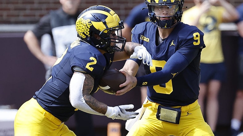 Sep 2, 2023; Ann Arbor, Michigan, USA; Michigan Wolverines quarterback J.J. McCarthy (9) hands off to running back Blake Corum (2) in the first half against the East Carolina Pirates at Michigan Stadium. Mandatory Credit: Rick Osentoski-USA TODAY Sports