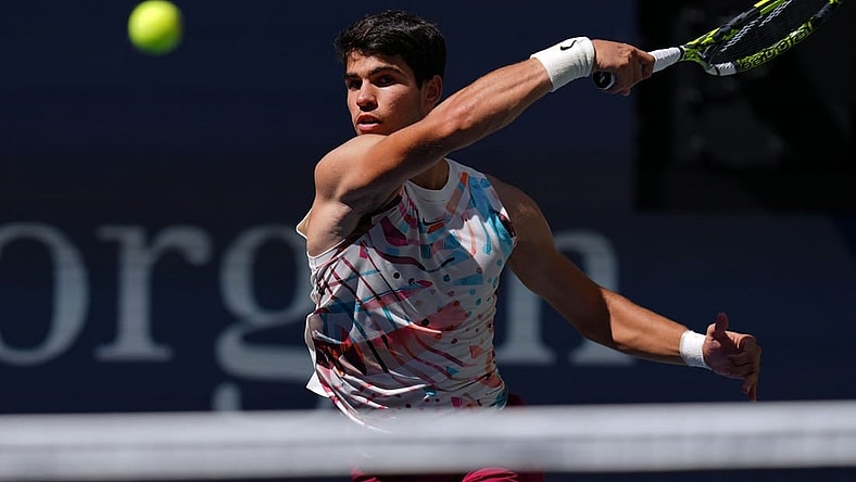 Sep 2, 2023; Flushing, NY, USA; Carlos Alcaraz of Spain hits to Daniel Evans of Great Britain on day six of the 2023 U.S. Open tennis tournament at USTA Billie Jean King National Tennis Center. Mandatory Credit: Danielle Parhizkaran-USA TODAY Sports