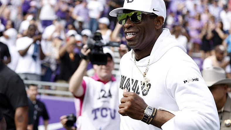 Sep 2, 2023; Fort Worth, Texas, USA; Colorado Buffaloes head coach Deion Sanders runs on the field before the game against the TCU Horned Frogs at Amon G. Carter Stadium. Mandatory Credit: Tim Heitman-USA TODAY Sports
