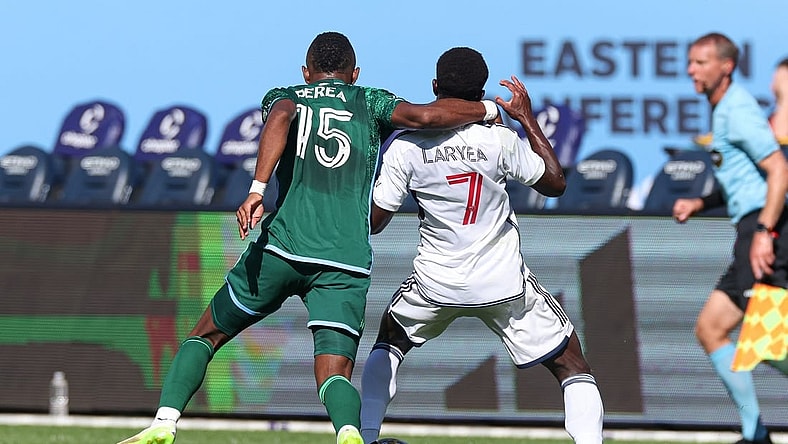Sep 2, 2023; New York, New York, USA; New York City FC midfielder Andres Perea (15) fouls Vancouver Whitecaps forward Richie Laryea (7) during the first half at Yankee Stadium. Mandatory Credit: Vincent Carchietta-USA TODAY Sports