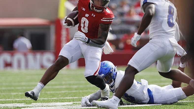 Sep 2, 2023; Madison, Wisconsin, USA;  Wisconsin Badgers running back Braelon Allen (0) rushes with the football during the second quarter against the Buffalo Bulls at Camp Randall Stadium. Mandatory Credit: Jeff Hanisch-USA TODAY Sports