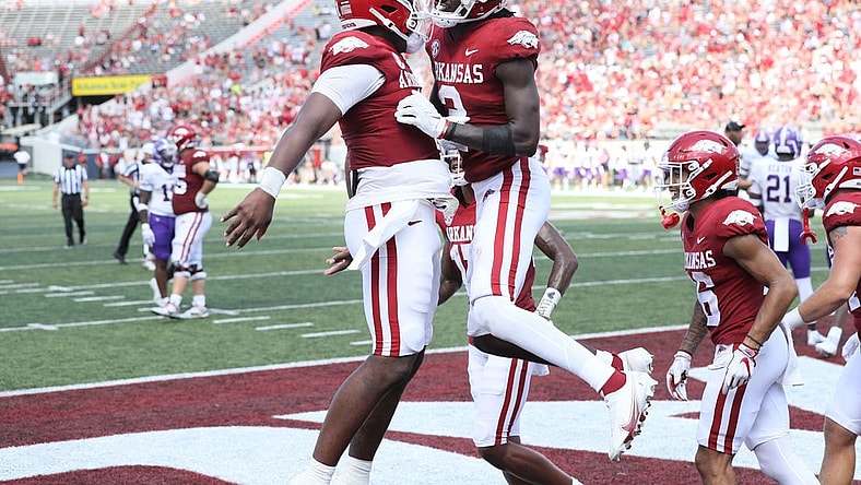 Sep 2, 2023; Little Rock, Arkansas, USA; Arkansas Razorbacks quarterback KJ Jefferson (1) and wide receiver Andrew Armstrong (2) celebrate after a touchdown against the Western Carolina Catamounts at War Memorial Stadium. Arkansas won 56-13. Mandatory Credit: Nelson Chenault-USA TODAY Sports