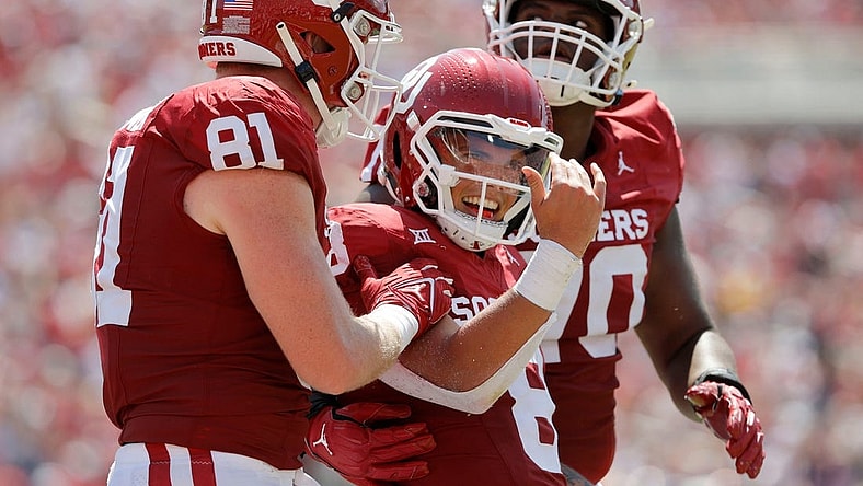 Oklahoma's Dillon Gabriel (8) celebrates beside Austin Stogner (81) and Cayden Green (70) after running for a touchdown during a college football game between the University of Oklahoma Sooners (OU) and the Arkansas State Red Wolves at Gaylord Family-Oklahoma Memorial Stadium in Norman, Okla., Saturday, Sept. 2, 2023.
