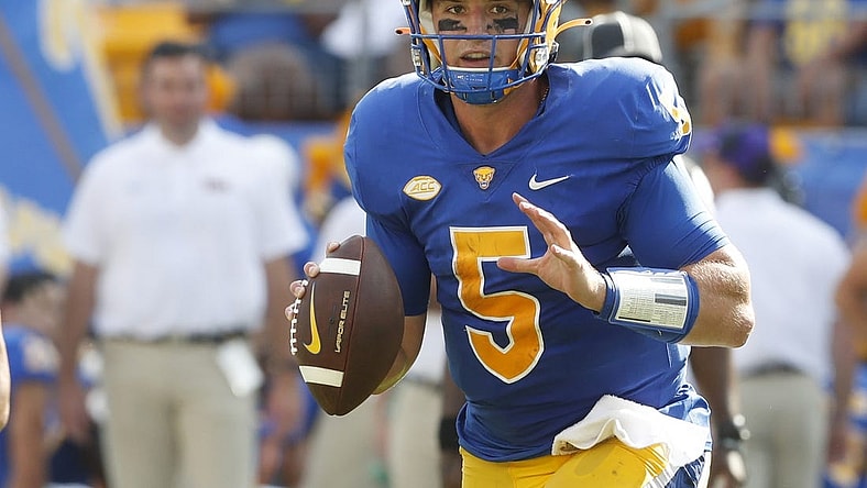 Sep 2, 2023; Pittsburgh, Pennsylvania, USA; Pittsburgh Panthers quarterback Phil Jurkovec (5) scrambles with the ball against the Wofford Terriers during the second quarter at Acrisure Stadium. Mandatory Credit: Charles LeClaire-USA TODAY Sports