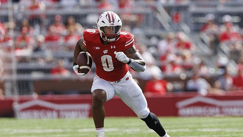 Sep 2, 2023; Madison, Wisconsin, USA;  Wisconsin Badgers running back Braelon Allen (0) rushes with the football during the second quarter against the Buffalo Bulls at Camp Randall Stadium. Mandatory Credit: Jeff Hanisch-USA TODAY Sports