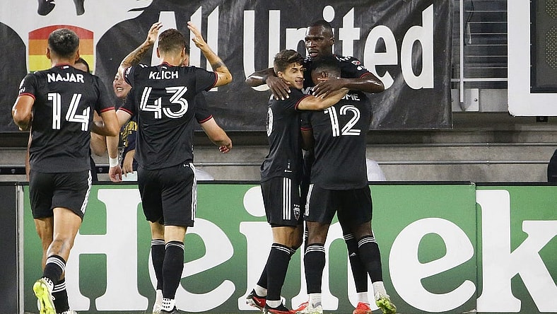 Sep 2, 2023; Washington, District of Columbia, USA; D.C. United forward Christian Benteke (20) celebrates with teammates after scoring a goal against Chicago Fire during the first half at Audi Field. Mandatory Credit: Amber Searls-USA TODAY Sports