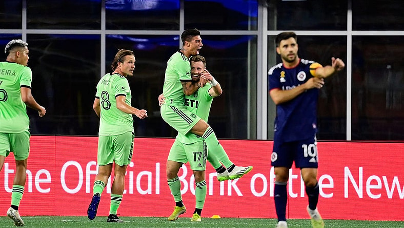 Sep 2, 2023; Foxborough, Massachusetts, USA;  Austin FC midfielder Emiliano Rigoni (7) celebrates his goal by jumping to the arms of midfielder Jon Gallagher (17) during the first half at Gillette Stadium. Mandatory Credit: Eric Canha-USA TODAY Sports