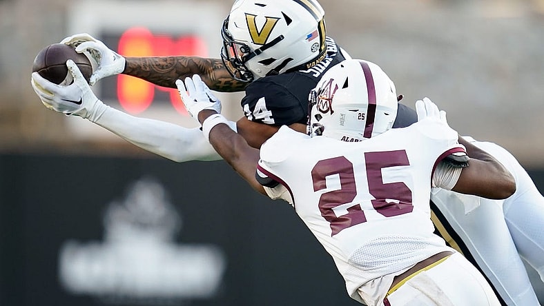 Vanderbilt wide receiver Will Sheppard (14) receives a pass over Alabama A&M cornerback Terphil Bien-Amie (25) during the first quarter at FirstBank Stadium in Nashville, Tenn., Saturday, Sept. 2, 2023.