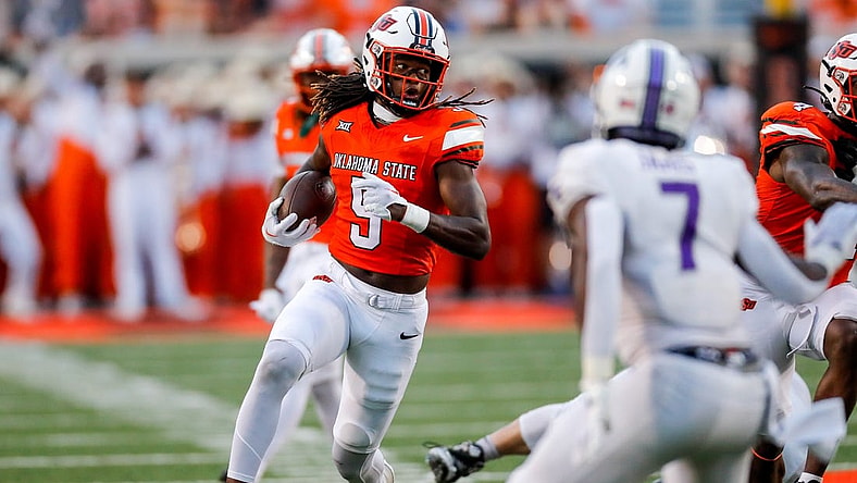 Sep 2, 2023; Stillwater, Oklahoma, USA; Oklahoma State's Kendal Daniels (5) returns a recovered a fumble against Central Arkansas in the second quarter at Boone Pickens Stadium. Mandatory Credit: Nathan J. Fish-USA TODAY Sports