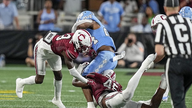 Sep 2, 2023; Charlotte, North Carolina, USA; South Carolina Gamecocks linebacker Mohamed Kaba (32) tackles North Carolina Tar Heels running back British Brooks (24) during the second quarter at Bank of America Stadium. Mandatory Credit: Jim Dedmon-USA TODAY Sports
