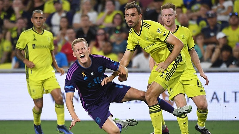Sep 2, 2023; Nashville, Tennessee, USA; Charlotte FC forward Karol Swiderski (11) in action against Nashville SC defender Jack Maher (5) during the first half at Geodis Park. Mandatory Credit: Christopher Hanewinckel-USA TODAY Sports