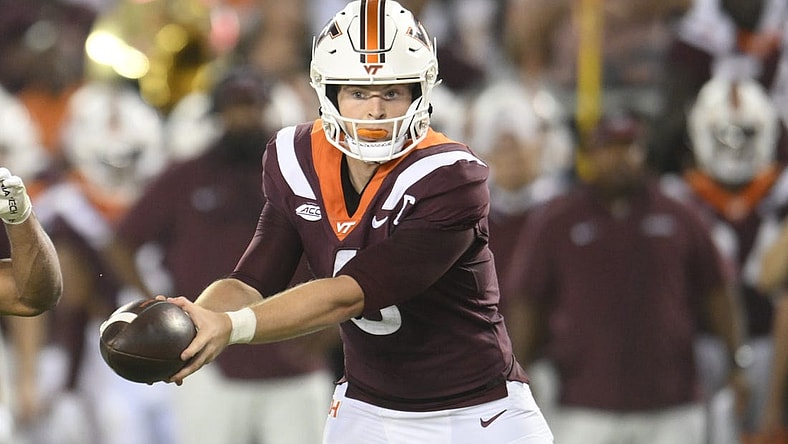 Sep 2, 2023; Blacksburg, Virginia, USA;  Virginia Tech Hokies quarterback Grant Wells (6)  hands off ball in the second quarter against the Old Dominion Monarchs at Lane Stadium. Mandatory Credit: Lee Luther Jr.-USA TODAY Sports
