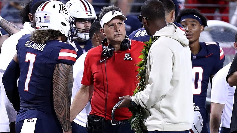 Sep 2, 2023; Tucson, Arizona, USA; Arizona Wildcats head coach Jedd Fisch talks the Arizona Wildcats quarterback Jayden de Laura (7) after an interception during the second half at Arizona Stadium. Mandatory Credit: Zac BonDurant-USA TODAY Sports