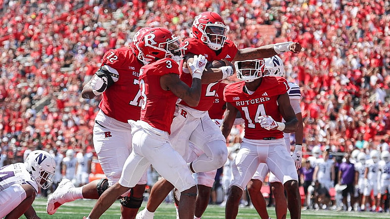Sep 3, 2023; Piscataway, New Jersey, USA; Rutgers Scarlet Knights quarterback Gavin Wimsatt (2) celebrates his touchdown with teammates during the first half against the Northwestern Wildcats at SHI Stadium. Mandatory Credit: Vincent Carchietta-USA TODAY Sports