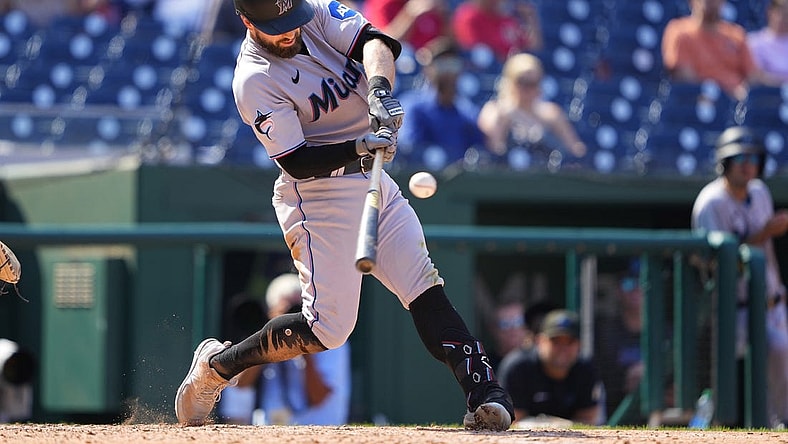 Sep 3, 2023; Washington, District of Columbia, USA;  Miami Marlins third baseman Jon Berti (5) hits a single against the Washington Nationals during the sixth inning at Nationals Park. Mandatory Credit: Gregory Fisher-USA TODAY Sports