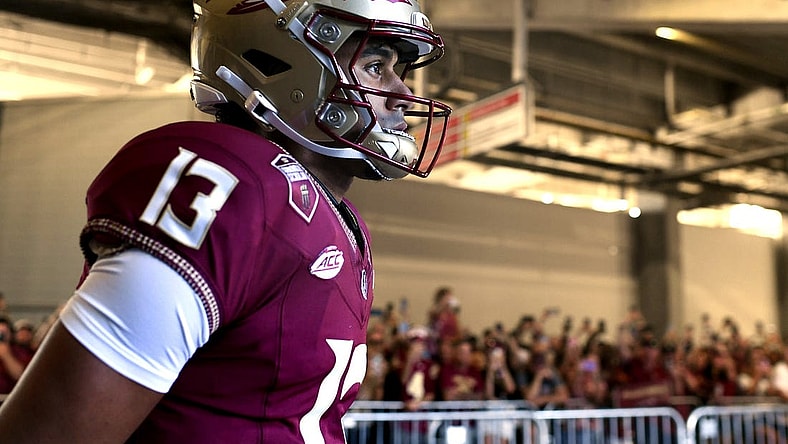 Sep 3, 2023; Orlando, Florida, USA; Florida State Seminoles quarterback Jordan Travis (13) takes the field before the game against the LSU Tigers at Camping World Stadium. Mandatory Credit: Melina Myers-USA TODAY Sports