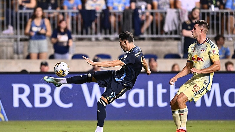 Sep 3, 2023; Philadelphia, Pennsylvania, USA; Philadelphia Union forward Julian Carranza (9) passes the ball against New York Red Bulls defender Sean Nealis (15) in the first half at Subaru Park. Mandatory Credit: Kyle Ross-USA TODAY Sports