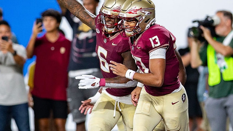 Florida State Seminoles tight end Jaheim Bell (6) and Florida State Seminoles quarterback Jordan Travis (13) celebrate a touchdown during a game against the LSU Tigers on Sunday, Sept. 3, 2023.