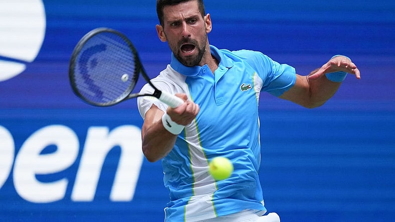 Sep 5, 2023; Flushing, NY, USA; Novak Djokovic of Serbia hits to Taylor Fritz of the United States on day nine of the 2023 U.S. Open tennis tournament at USTA Billie Jean King National Tennis Center. Mandatory Credit: Danielle Parhizkaran-USA TODAY Sports