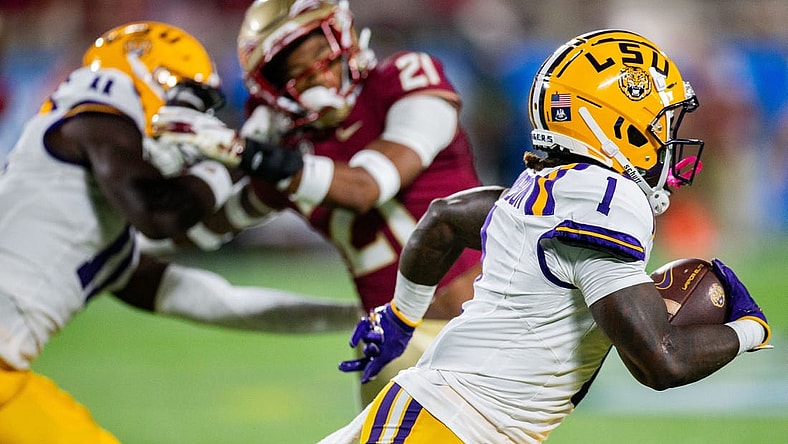 LSU's Aaron Anderson runs with the ball against the Florida State Seminoles 17-14 at the half of the Camping World Kickoff on Sunday, Sept. 3, 2023.