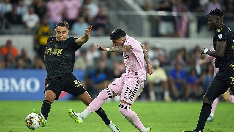 Sep 3, 2023; Los Angeles, California, USA; Inter Miami CF midfielder Facundo Far  as (11) moves the ball against LAFC defender Aaron Long (33) at BMO Stadium. Mandatory Credit: Kirby Lee-USA TODAY Sports