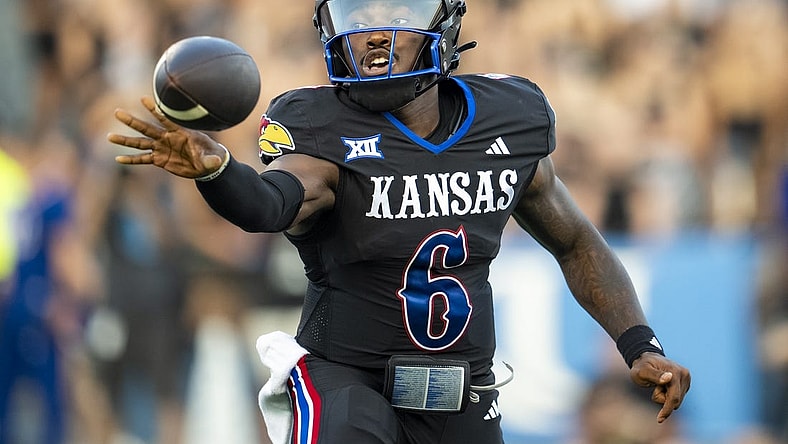 Sep 8, 2023; Lawrence, Kansas, USA; Kansas Jayhawks quarterback Jalon Daniels (6) pitches the ball during the first half against the Illinois Fighting Illini at David Booth Kansas Memorial Stadium. Mandatory Credit: Jay Biggerstaff-USA TODAY Sports