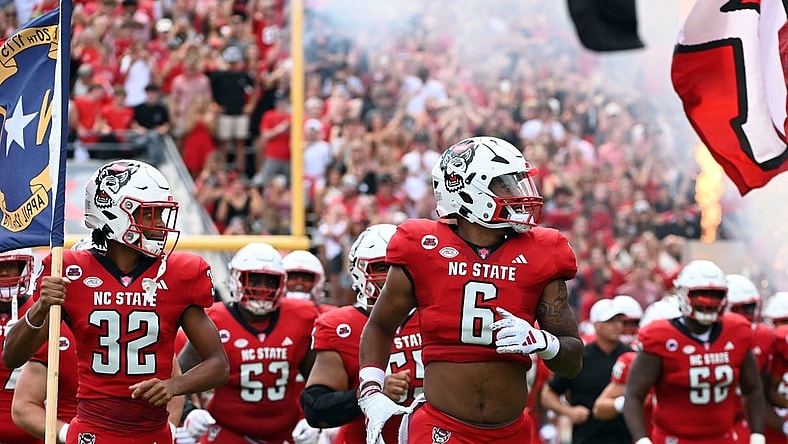 Sep 9, 2023; Raleigh, North Carolina, USA; North Carolina State Wolfpack players take the field prior to a game against the Notre Dame Fighting Irish at Carter-Finley Stadium. Mandatory Credit: Rob Kinnan-USA TODAY Sports