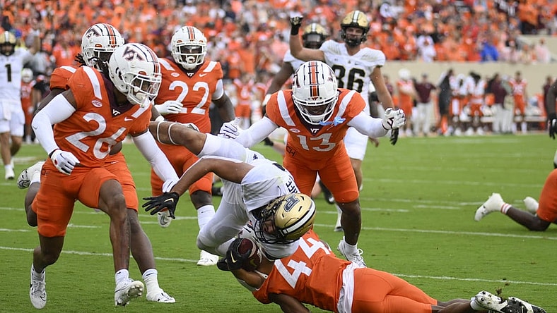 Sep 9, 2023; Blacksburg, Virginia, USA; Virginia Tech Hokies cornerback Dorian Strong (44) attempts to tackle Purdue Boilermakers running back Devin Mockobee (45) but he could not stop the dive into the end zone in the first quarter at Lane Stadium. Mandatory Credit: Lee Luther Jr.-USA TODAY Sports