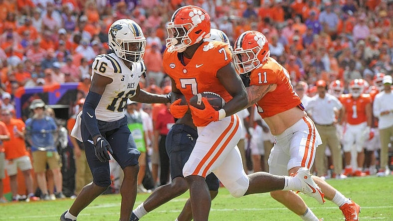 Sep 9, 2023; Clemson, South Carolina, USA; Clemson running back Phil Mafah (7) scores a touchdown near Charleston Southern safety Davion Williams (16) during the first quarter at Memorial Stadium. Mandatory Credit: Ken Ruinard-USA TODAY Sports
