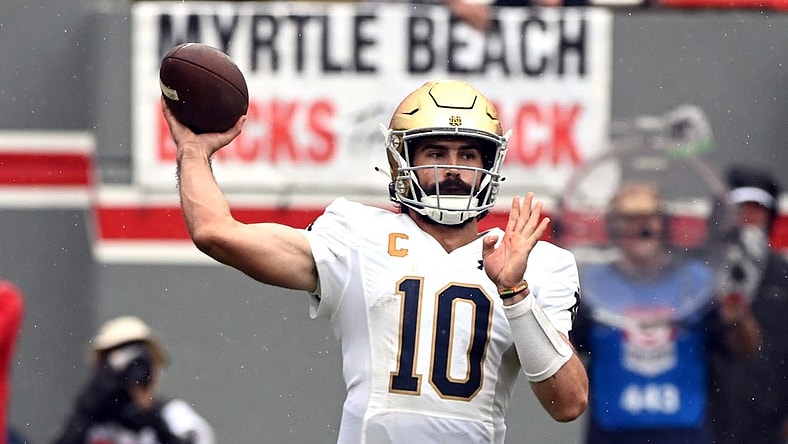 Sep 9, 2023; Raleigh, North Carolina, USA;Notre Dame Fighting Irish quarterback Sam Hartman (10) throws a pass during the first half against the North Carolina State Wolfpack at Carter-Finley Stadium. Mandatory Credit: Rob Kinnan-USA TODAY Sports