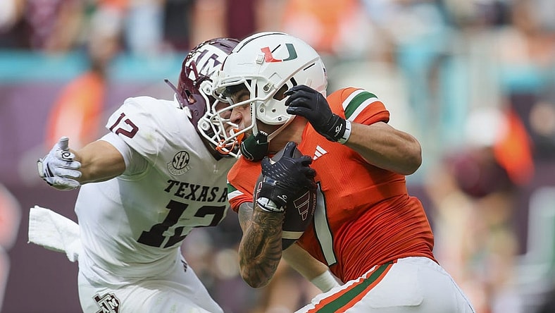Sep 9, 2023; Miami Gardens, Florida, USA; Miami Hurricanes wide receiver Xavier Restrepo (7) runs with the football against the Texas A&M Aggies during the first quarter at Hard Rock Stadium. Mandatory Credit: Sam Navarro-USA TODAY Sports