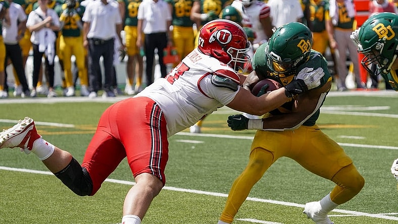 Sep 9, 2023; Waco, Texas, USA; Utah Utes defensive tackle Keanu Tanuvasa (57) tackles Baylor Bears running back Richard Reese (29) during the second half at McLane Stadium. Mandatory Credit: Raymond Carlin III-USA TODAY Sports