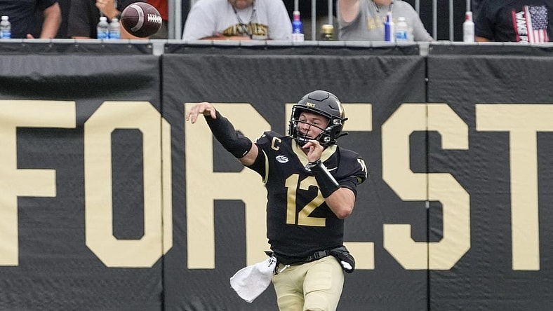 Sep 9, 2023; Winston-Salem, North Carolina, USA; Wake Forest Demon Deacons quarterback Mitch Griffis (12) passes near the end zone during the second half against the Vanderbilt Commodores at Allegacy Federal Credit Union Stadium. Mandatory Credit: Jim Dedmon-USA TODAY Sports
