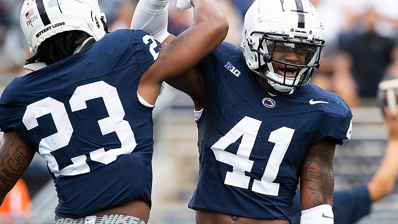 Penn State linebackers Kobe King (41) and Curtis Jacobs (23) get pumped up before facing off against Delaware Saturday, Sept. 9, 2023, in State College, Pa.