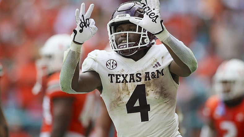 Sep 9, 2023; Miami Gardens, Florida, USA; Texas A&M Aggies running back Amari Daniels (4) reacts after scoring a touchdown against the Miami Hurricanes during the second quarter at Hard Rock Stadium. Mandatory Credit: Sam Navarro-USA TODAY Sports
