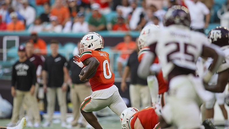Sep 9, 2023; Miami Gardens, Florida, USA; Miami Hurricanes wide receiver Brashard Smith (0) returns the football for a touchdown against the Texas A&M Aggies during the third quarter at Hard Rock Stadium. Mandatory Credit: Sam Navarro-USA TODAY Sports