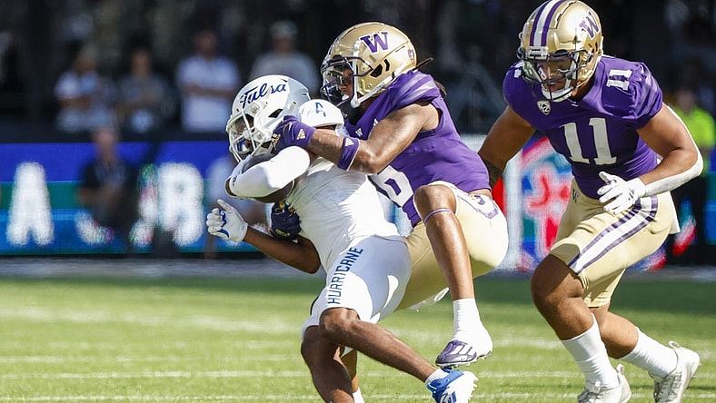 Sep 9, 2023; Seattle, Washington, USA; Washington Huskies cornerback Davon Banks (6) tackles Tulsa Golden Hurricane wide receiver Marquis Shoulders (4) following a second quarter reception at Alaska Airlines Field at Husky Stadium. Mandatory Credit: Joe Nicholson-USA TODAY Sports