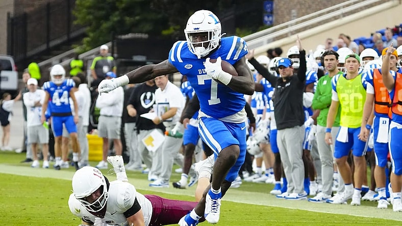 Sep 9, 2023; Durham, North Carolina, USA;  Duke Blue Devils running back Jordan Waters (7) makes a catch past Lafayette Leopards linebacker Preston Forney (18) during the first half at Wallace Wade Stadium. Mandatory Credit: James Guillory-USA TODAY Sports