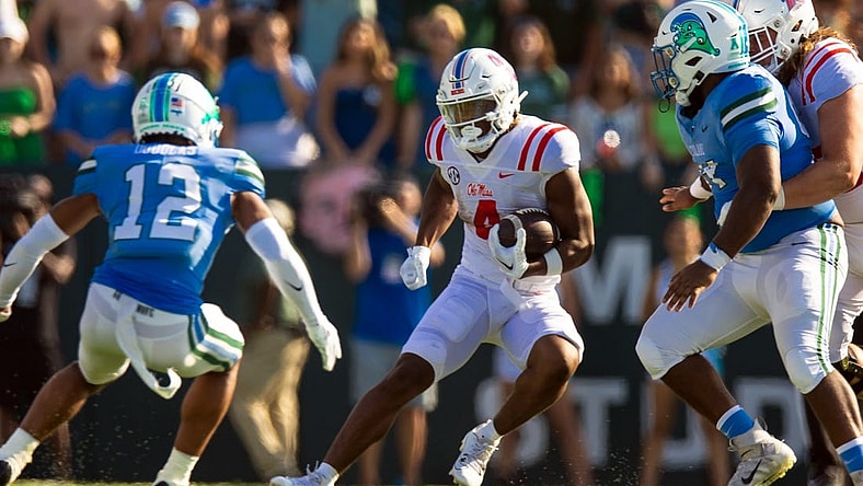 Sep 9, 2023; New Orleans, Louisiana, USA;  Mississippi Rebels running back Quinshon Judkins (4) rushes against Tulane Green Wave defensive back DJ Douglas (12) during the second half at Yulman Stadium. Mandatory Credit: Stephen Lew-USA TODAY Sports