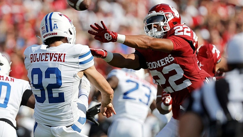 Oklahoma's Peyton Bowen (22) blocks the punt of SMU's Ryan Bujcevski (92) in the first half during the college football game between the University of Oklahoma Sooners and the Southern Methodist University Mustangs at the Gaylord Family Oklahoma Memorial Stadium in Norman, Okla., Saturday, Sept. 9, 2023.