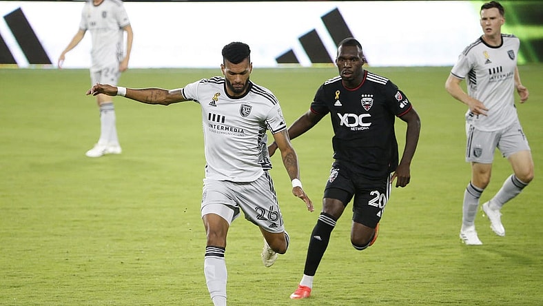 Sep 9, 2023; Washington, District of Columbia, USA; San Jose Earthquakes defender Rodrigues (26) kicks the ball away from D.C. United forward Christian Benteke (20) during the first half at Audi Field. Mandatory Credit: Amber Searls-USA TODAY Sports