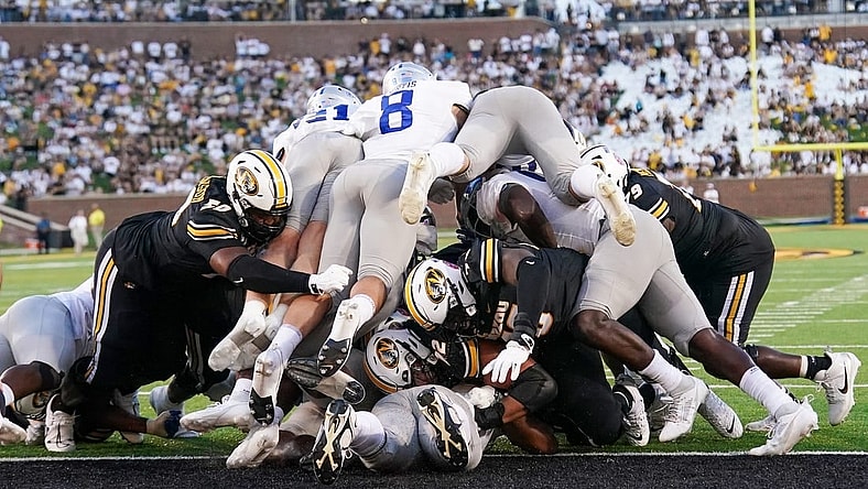 Sep 9, 2023; Columbia, Missouri, USA; Missouri Tigers quarterback Brady Cook (12) punches in for a touchdown against the Middle Tennessee Blue Raiders during the first half at Faurot Field at Memorial Stadium. Mandatory Credit: Denny Medley-USA TODAY Sports