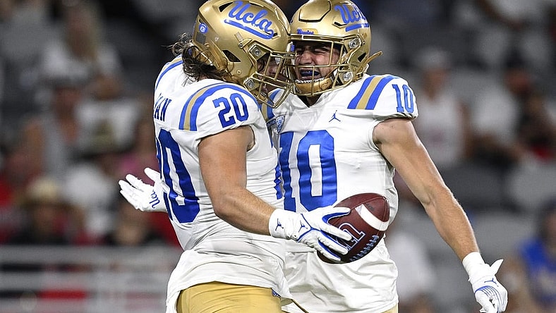 Sep 9, 2023; San Diego, California, USA; UCLA Bruins running back Carsen Ryan (20) celebrates with wide receiver Ryan Cragun (10) after scoring a touchdown against the San Diego State Aztecs during the second half at Snapdragon Stadium. Mandatory Credit: Orlando Ramirez-USA TODAY Sports
